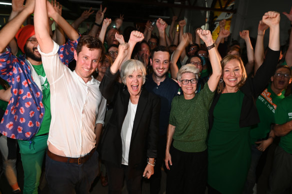 Max Chandler-Mather and Elizabeth Watson-Brown (in black) celebrate their success at the federal election in May with supporters.
