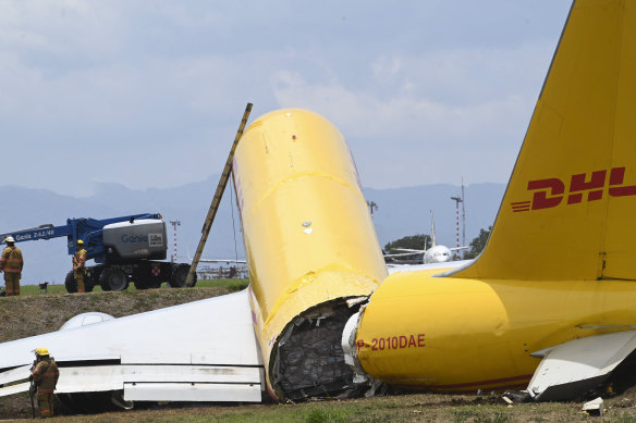 A cargo jet that spun off lays broken on the runway of the Juan Santamaria International Airport in Alajuela, Costa Rica.