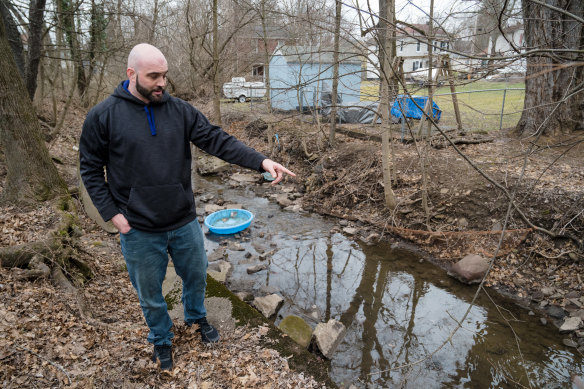 Chris Wallace outside his home, which is downstream from the derailment site in East Palestine, Ohio.