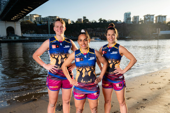 Dakota Davidson (left), Courtney Hodder (middle) and Ally Anderson wearing the Lions’ Indigenous jumper.