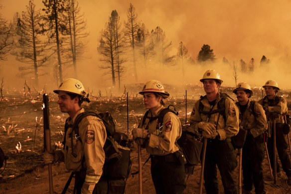 Firefighters from the California Department of Forestry and Fire Protection’s Placerville station battle a blaze in Doyle. 