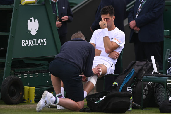 Thanasi Kokkinakis shows his frustration with the injury.