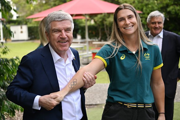 International Olympic Committee President Thomas Bach with BMX Freestyle competitor Natalya Diehm during a visit to Brisbane State High School.