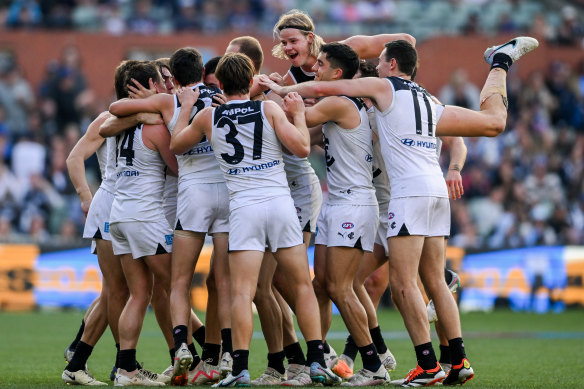 The Blues celebrate their win.