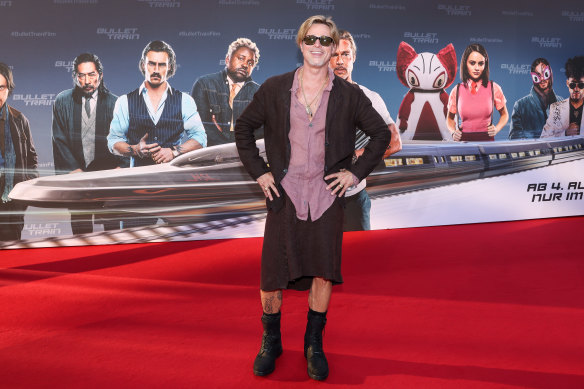 Brad Pitt attends the “Bullet Train” Red Carpet Screening at Hotel Adlon on July 19, 2022 in Berlin wearing a skirt and matching jacket from NY designer Haans Nicholas Mott.