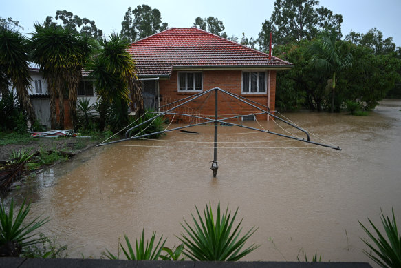 Queenslanders living in flooded homes, such as this one in Goodna, will have the option to retrofit, raise or sell their house.