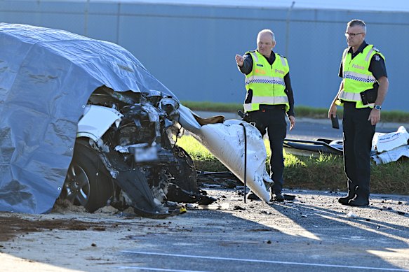 Police officers at the scene of the double-fatal crash at Clayton South on Monday.