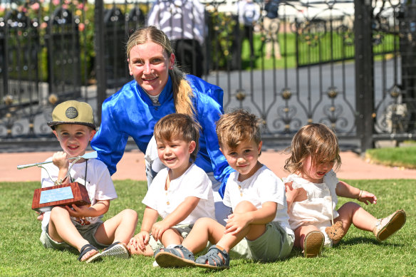 Jamie Kah with Dean Holland’s children after winning the Newmarket Handicap.