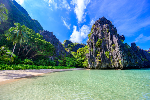 Hidden Beach, El Nido, The Philippines. A four-kilometre stretch of bone-white sand surrounded by limestone cliffs only reachable via a hole in the rocks.