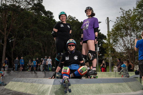 Inner West Roller Derby members Teigan Butchers (player name: Rainbow Smash), left, Dilys Norrish (player name: Flower Power), centre, and Aja Cordner (player name: Vicious D’Licious).
