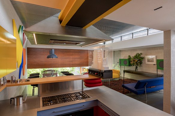 At the top of the stairs is an open-plan kitchen, dining and living area which features corrugated zinc veiling that complements the studded rubber floor – the latter also a hallmark of Le Corbusier.