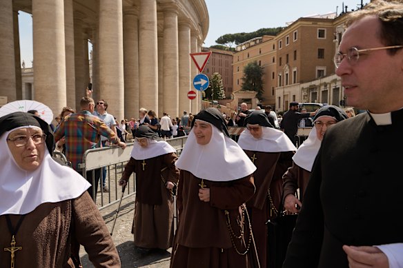 Nuns join those paying their respects at the Vatican on Wednesday.
