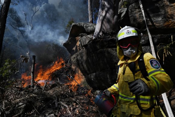 RFS Firefighter Jade Garrett from Killara brigade takes part in a 
hazard-reduction burn in Westleigh, in Sydney's north.