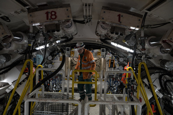 A worker inside the massive boring machine that is about to start tunnelling under Sydney Harbour.
