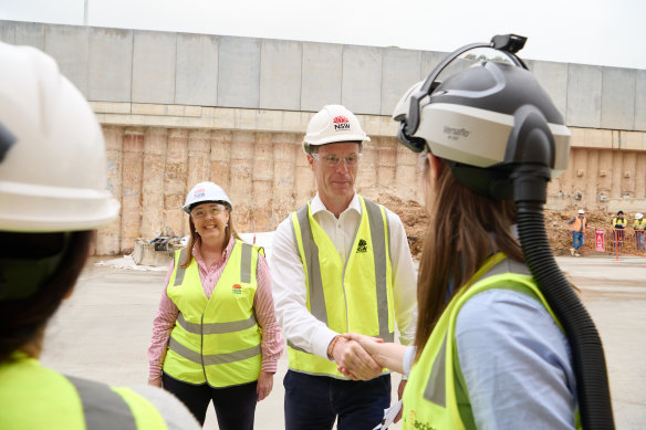 Premier Chris Minns and Roads Minister Jenny Aitchison chat to construction workers on Monday.