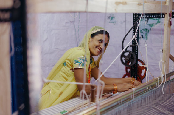 Working the hand loom.