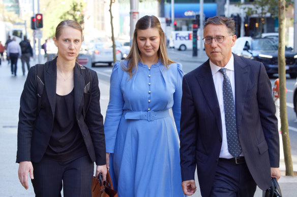 Brittany Higgins (centre) arrives at the Perth Supreme Court alongside lawyers Leon Zwier and Teresa Ward for a mediation session with former boss Linda Reynolds.