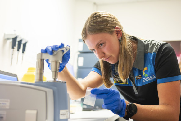 A lab technician conducts a demonstration at the CAHMA pill testing site, which opened in Canberra last year.