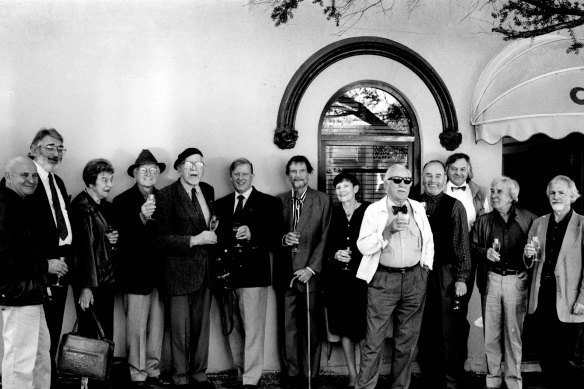 A 1994 lineup of arty types at Lucio's. From left: Col Jordan, Ken Reinhard, Anne von Bertouche, John Coburn, Stan Rapotec, Kym Bonython, Louis James, Pat James, Ross Luck, Charles Reddington, Mike Kicching, Frank Hodgkinson, Lou Klepac.