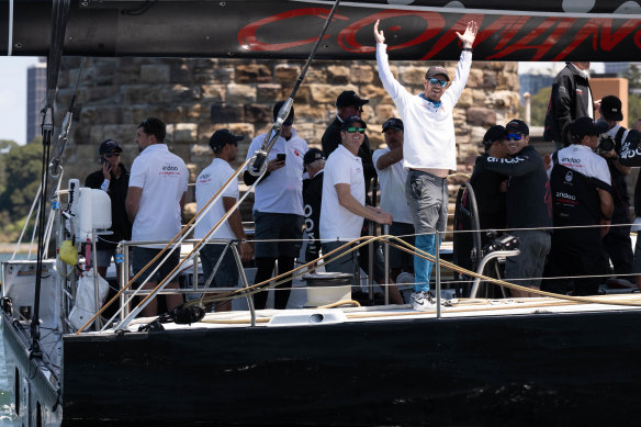 Captain John Winning and the crew of the mega yacht Comanche celebrate Tuesday's Big Boat Challenge victory.