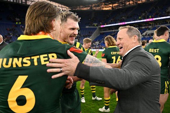 Kevin Walters celebrates the Ashes victory with Cameron Munster and Angus Crichton.
