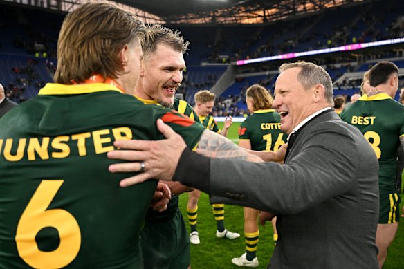 Kevin Walters celebrates Ashes victory with Cameron Munster and Angus Crichton in 2025. The coach will finish up as Kangaroos coach after the World Cup.