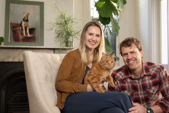 Daria and Collin Anderson with their cat, Phineas, who was born with cerebellar hypoplasia.