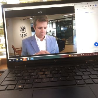 Steve Baird chats online from his Blue Mountains home with a virtual office backdrop behind him.