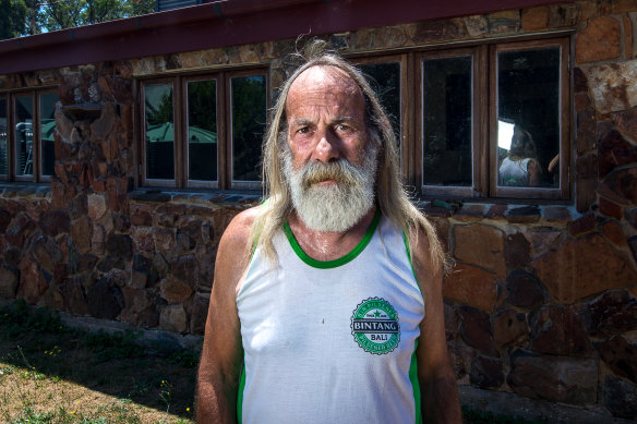 Rob Hallett 10 years on. He has rebuilt his home using the burnt stonework.