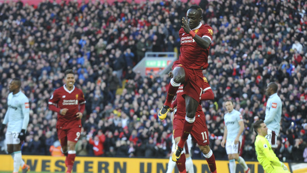 Sadio Mane celebrates Liverpool's fourth goal.