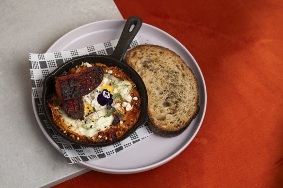 Shakshuka with olive oil and rosemary focaccia and baked eggs. 