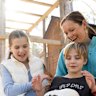 Alison Bransdon and her children, Madeleine, 11, and Harvey, 9, with the chickens they raise in their backyard in Sydney’s south.