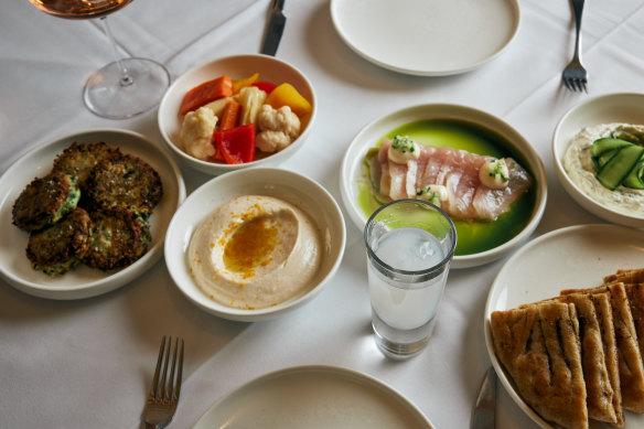 Assorted meze including zucchini kefte and tzatziki.