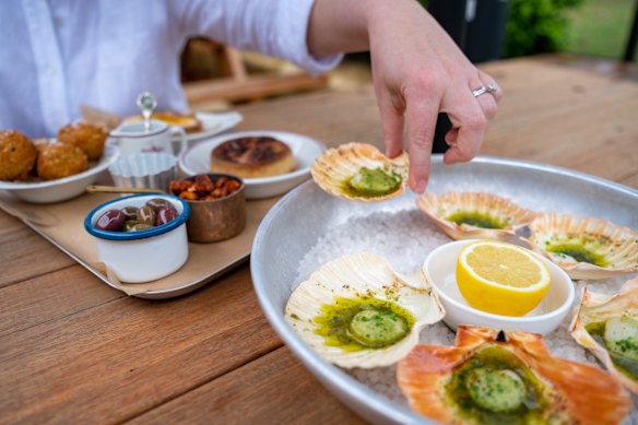 Scallops with garlic and herb butter.