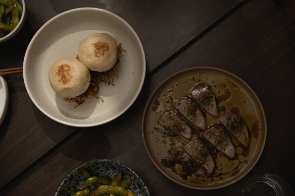 Steamed buns with charred sticky pork and umami jam, and kingfish sashimi with smoked ponzu and finger lime.