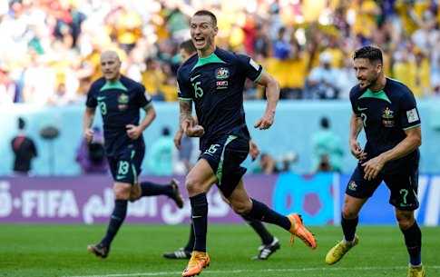Australia’s Mitchell Duke, center, celebrates after he scored the opening goal during the World Cup group D soccer match between Tunisia and Australia at the Al Janoub Stadium in Al Wakrah, Qatar, Saturday, Nov. 26, 2022. (AP Photo/Luca Bruno)