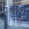 ASX closes flat; Telstra at four-year high, Woolies down 7.7%