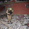 Army soldiers examine a building damaged by a suspected Indian missile attack near Muzaffarabad, the capital of Pakistan controlled Kashmir, Wednesday, May 7, 2025. (AP Photo/M.D. Mughal)