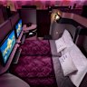 Qsuite converts to a lie-flat bed, with options for couples to remove centre-seat privacy screens.