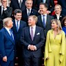 US President Donald Trump talks to secretary general of NATO Mark Rutte (centre) at the summit in The Hague on Tuesday.