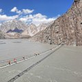Hussaini Suspension Bridge, a precarious 193-metres-long rope bridge spanning the Hunza River that looks dangerous but is used daily by locals.