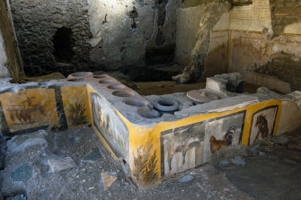A well-preserved thermopolium, or ancient snack bar, at Pompeii.