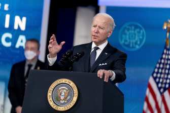 Intel CEO Patrick Gelsinger, left, listens as President Joe Biden speaks about Intel’s announcement to invest in an Ohio chip making facility on the White House Campus in Washington. 