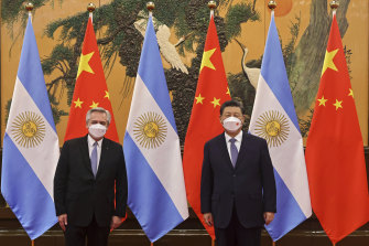 Chinese President Xi Jinping, right, and Argentina’s President Alberto Fernandez pose for a photo before their bilateral meeting in Beijing on Sunday.