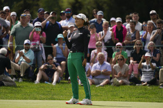 Minjee Lee reacts as she sinks her final putt to win.