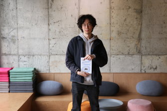 Kim Nae-hoon, 29, author of “Radical 20s: K-Populism and the Political”, poses for a portrait at a local café in Goyang, South Korea