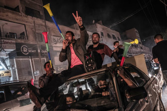 Palestinians in Gaza City celebrate the ceasefire agreement between Israel and Hamas on Friday.