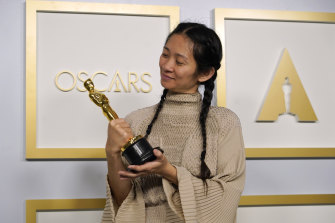 Chloe Zhao, winner of the best director and best picture awards for Nomadland, poses in the press room at the Oscars at Union Station in Los Angeles. 