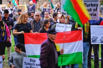 Protesters taking part in a Kurdish rally in front of the State Library in Melbourne on Saturday.
