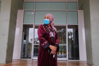 Ruth Eyakem, a resident of one of the  Flemington social housing towers, outside her building on Saturday.